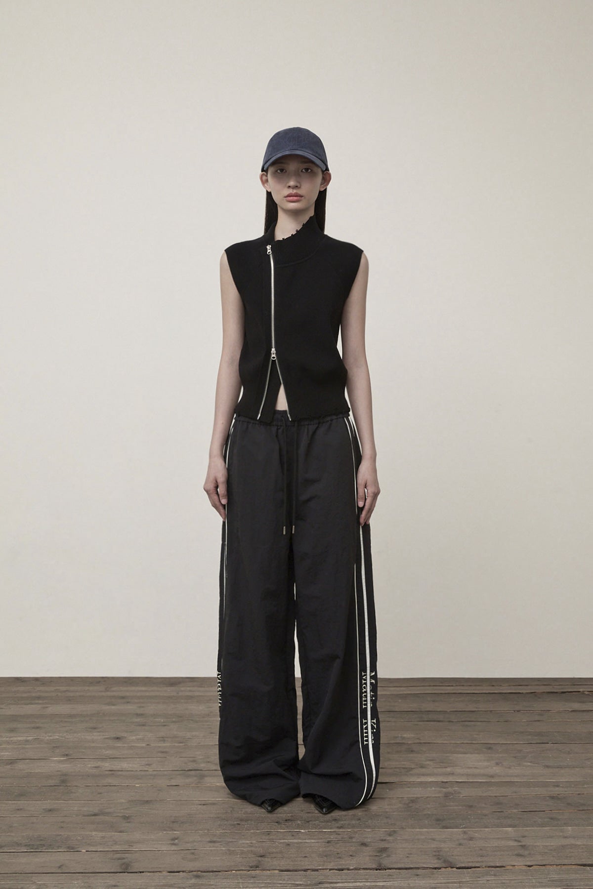 Matin Kim - High Neck Logo Knit Zip Up Vest (Black) product image 11 | TRAB K-Fashion Australia