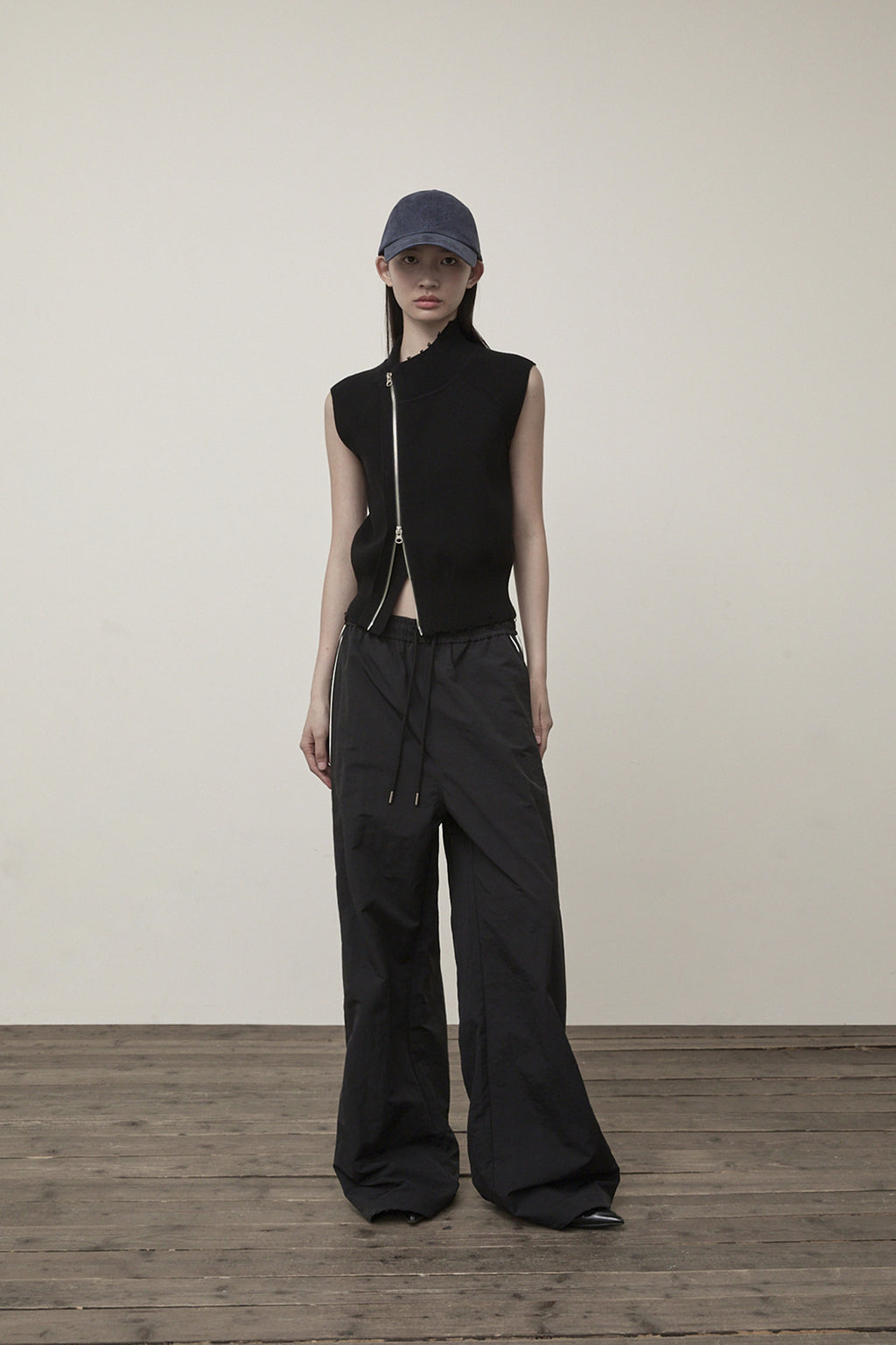 Matin Kim - High Neck Logo Knit Zip Up Vest (Black) product image 9 | TRAB K-Fashion Australia