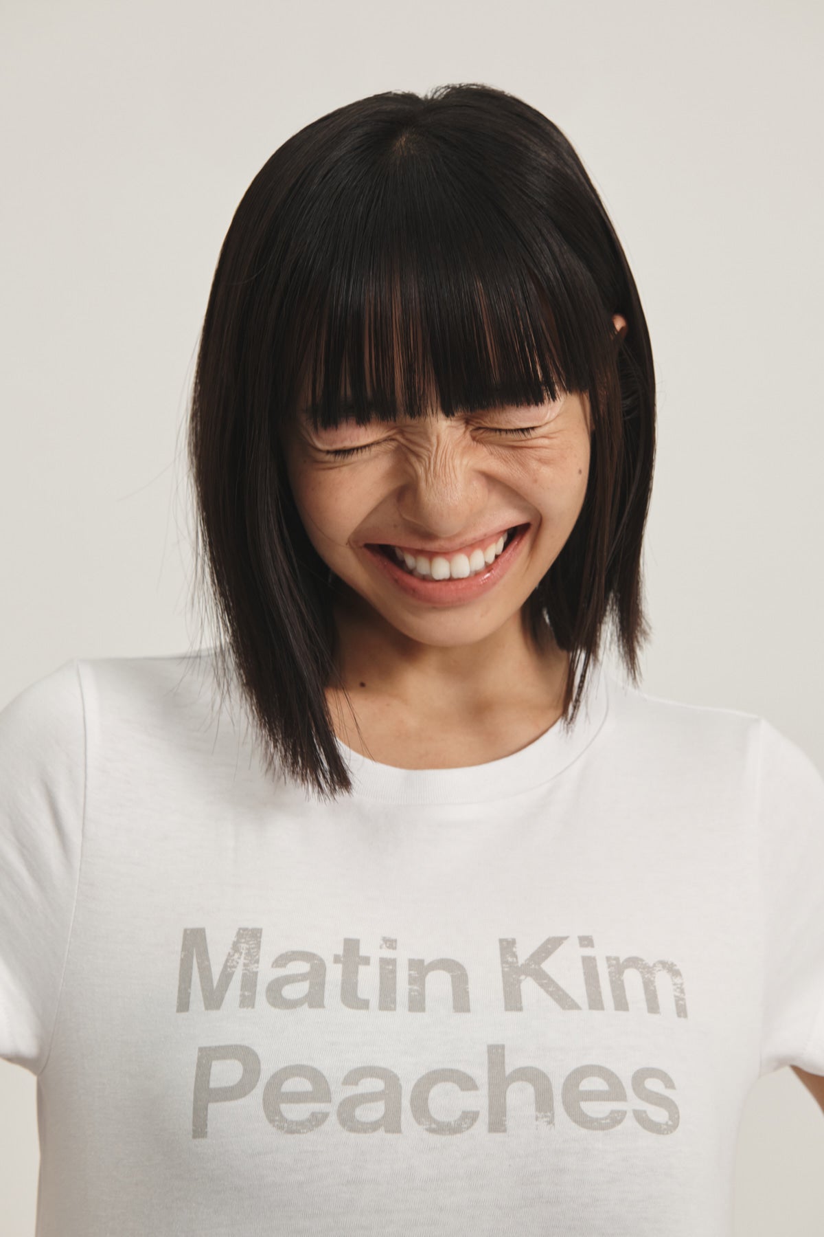 Matin Kim - Peaches Logo Graphic Crop Top (White) product image 1 | TRAB K-Fashion Australia